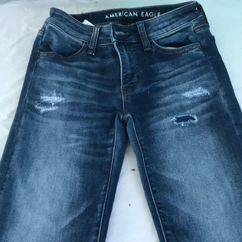 Square ripped blue jeans